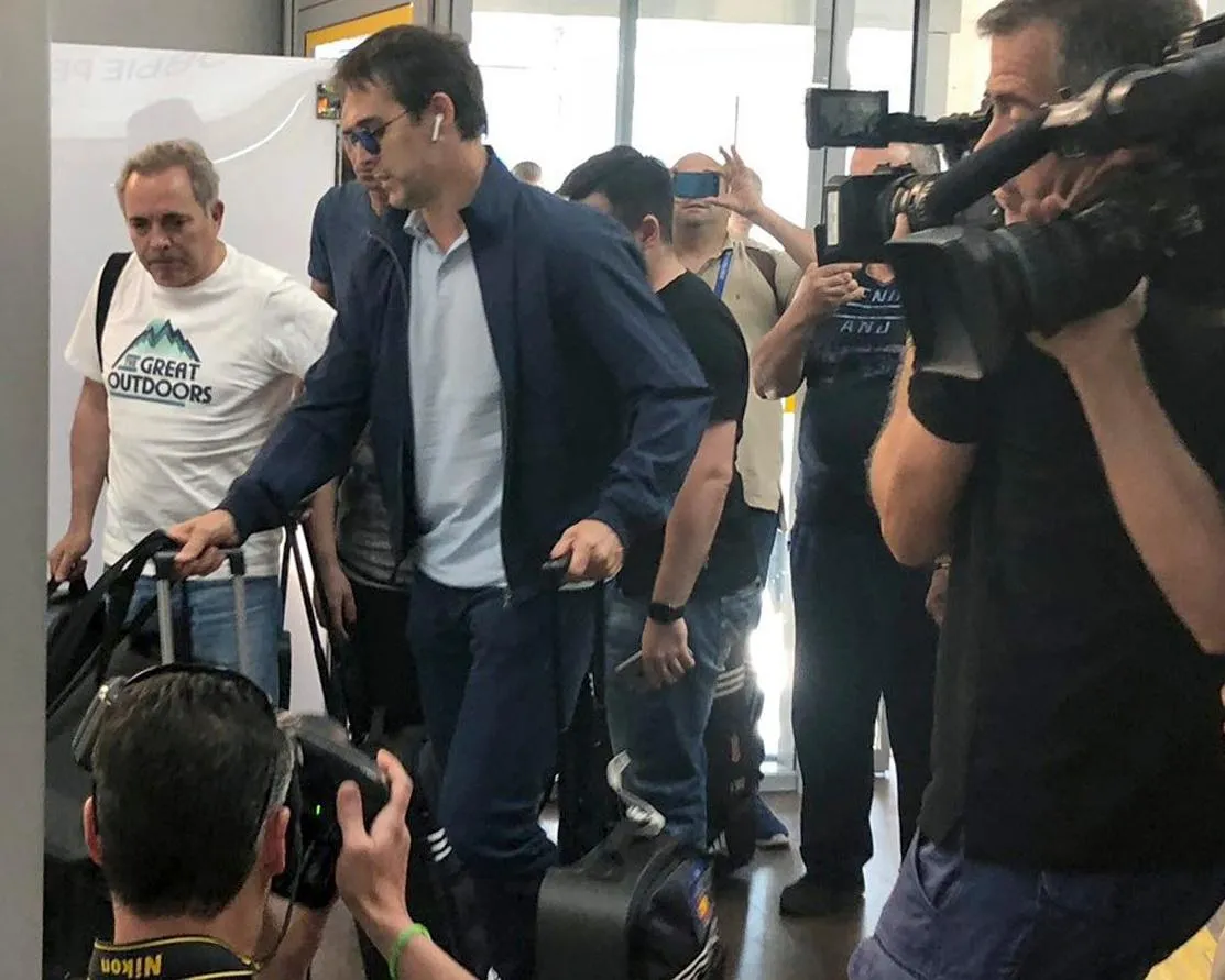 Julen Lopetegui (second left) arrives at Krasnodar Airport in Russia before flying back to Spain.