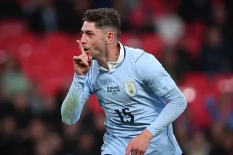 Federico Valverde celebrates during an international friendly Federico Valverde celebrates by putting his finger to his mouth during an international friendly with England at Wembley
