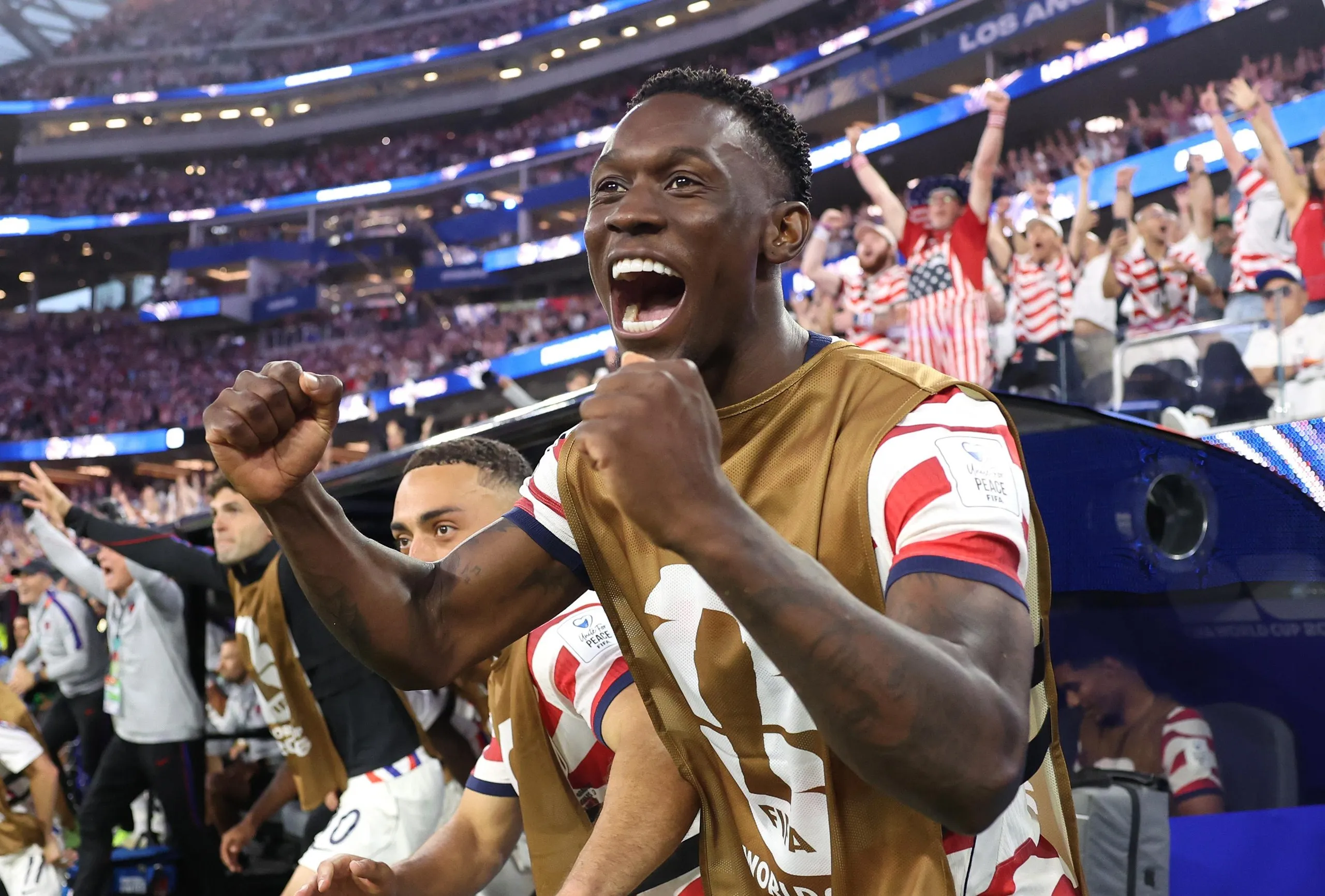 Folarin Balogun celebrates on the sidelines 
