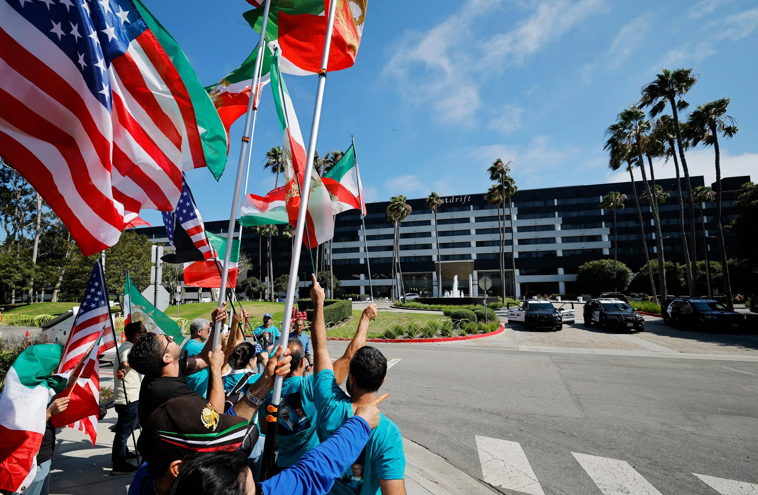 Protestors against the Iranian regime gather outside the hotel