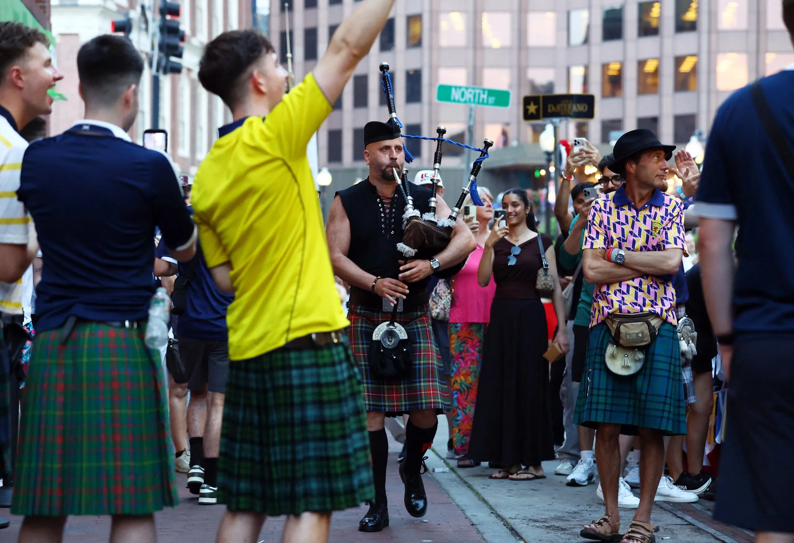 A bagpiper serenades Scotland fans in Boston, the scene of their Group C opener against Haiti