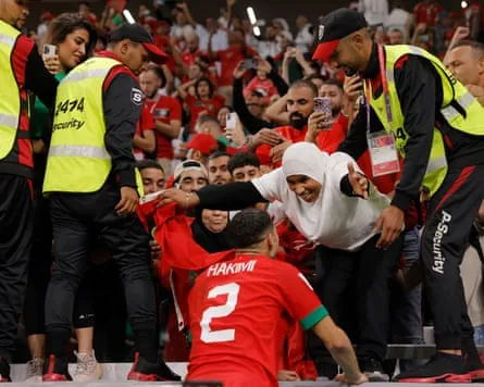 Achraf Hakimi, who scored the winning penalty for Morocco, greets his mother after the match against Spain in Doha, Qatar, 6 December 2022 Achraf Hakimi, who scored the winning penalty for Morocco, greets his mother after the match against Spain in Doha, Qatar, 6 December 2022