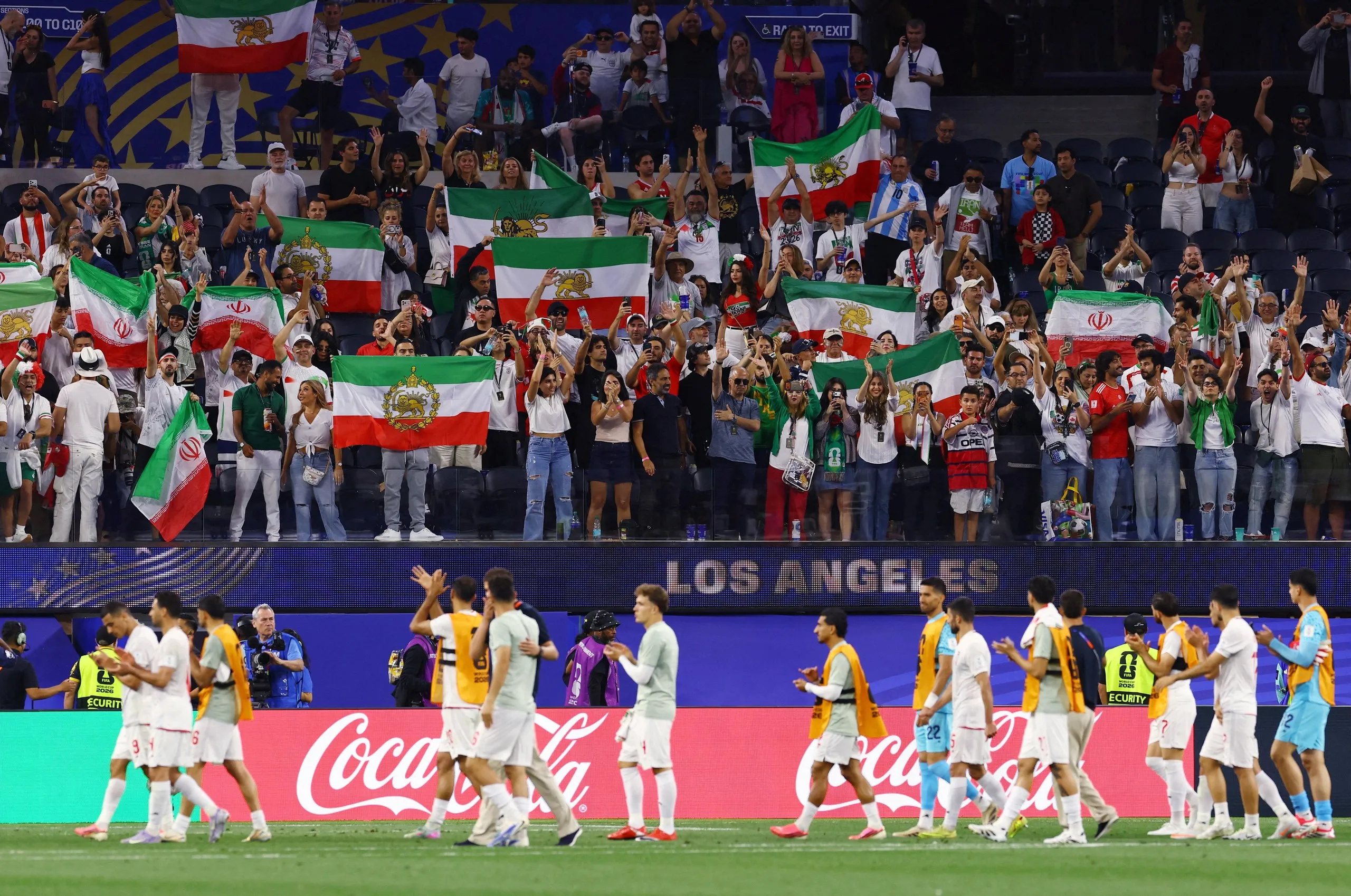 Iran fans celebrate at full-time.
